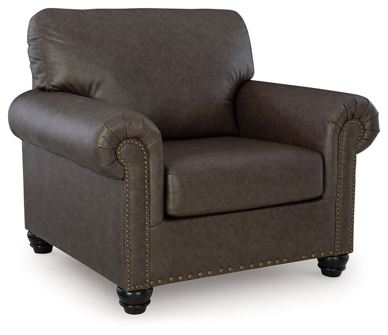 Benchcraft Roxmere living room set with stationary chair and matching ottoman, featuring plush upholstery and modern design.