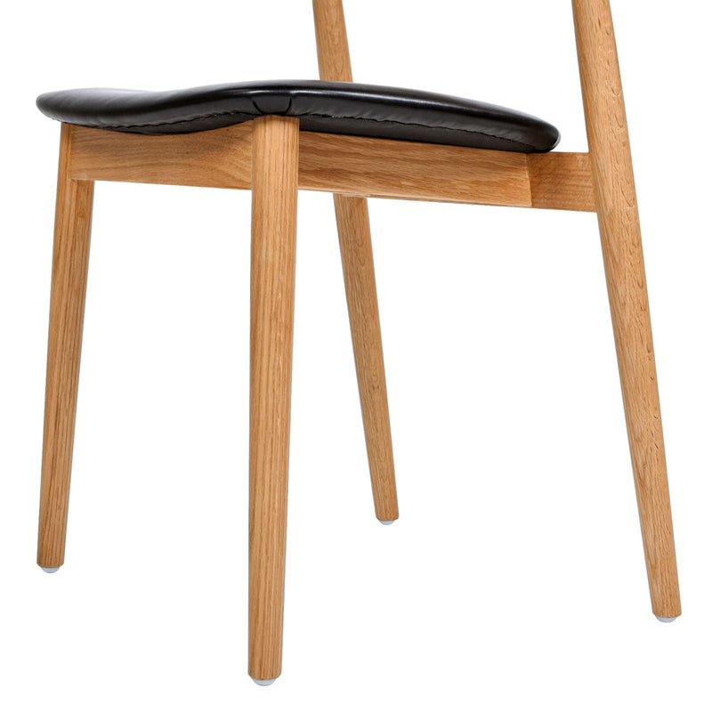 Raven - Stacking Sculpted Oak Dining Chair - Warm Natural Brown / Black - R&R Furniture Gallery (Fountain Valley, CA)