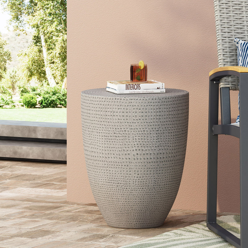 Outdoor lightweight concrete side table by Noble House in natural finish, featuring a sleek round tabletop and sturdy base.