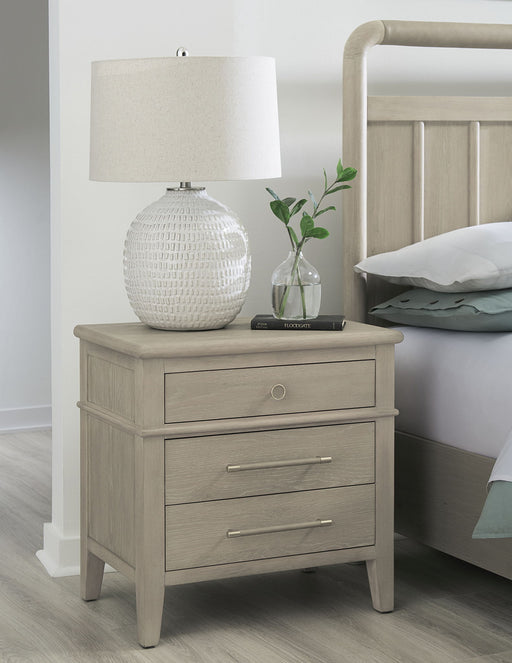 Modus Camden oak wood nightstand with three drawers in Chai finish, featuring a sleek standalone design.