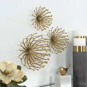 Uttermost Aga gold metal wall decor set of 3 with geometric circular designs, perfect for modern interior wall accents.