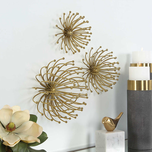 Uttermost Aga gold metal wall decor set of 3 with geometric circular designs, perfect for modern interior wall accents.