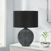 Contemporary black ceramic table lamp with sleek design, perfect for modern living spaces, by 8th Street.