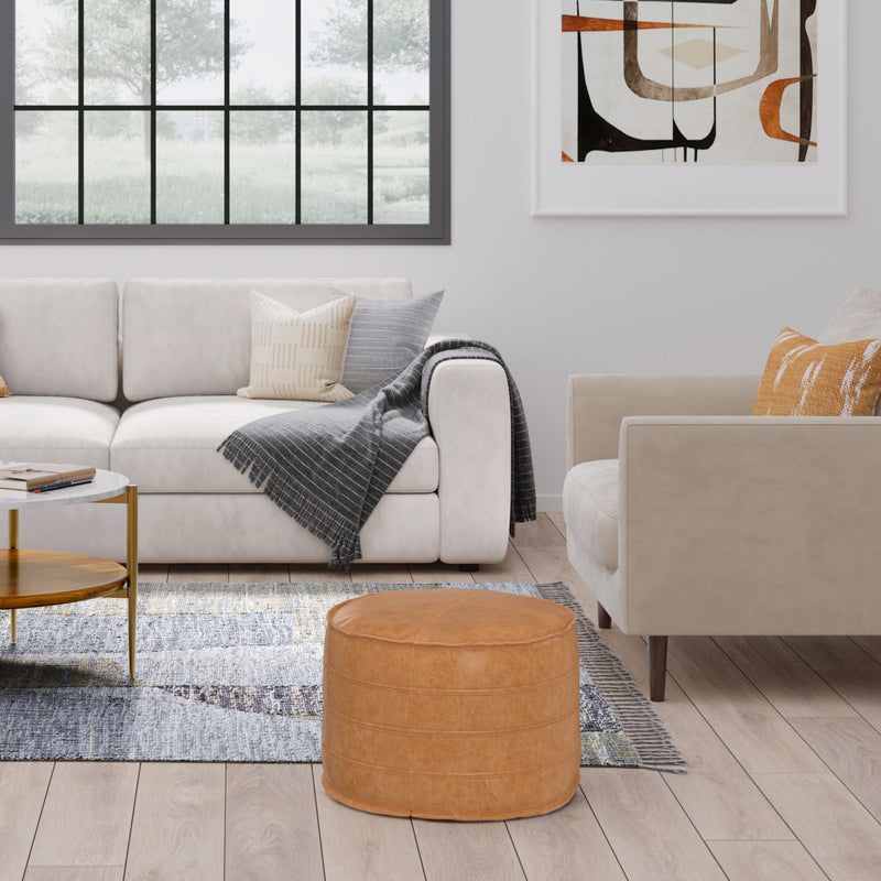 Simpli-Home Brody round accent pouf in neutral fabric, cushioned top, and stylish design for versatile seating or decor.