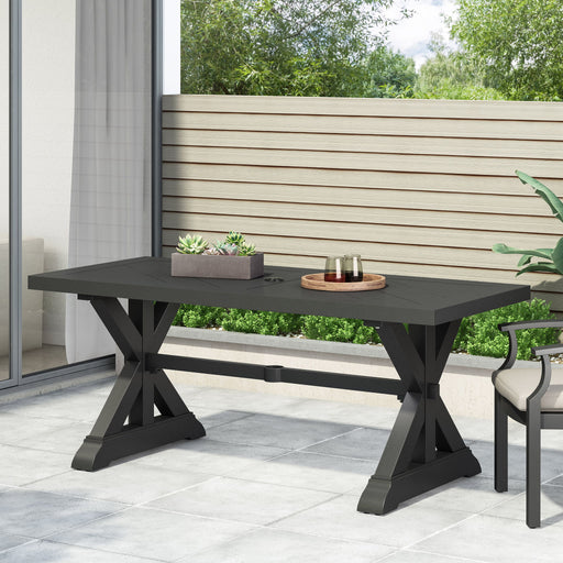 Modern Noble House outdoor dining table with X-shaped legs and umbrella hole, ideal for backyard or patio dining setups.