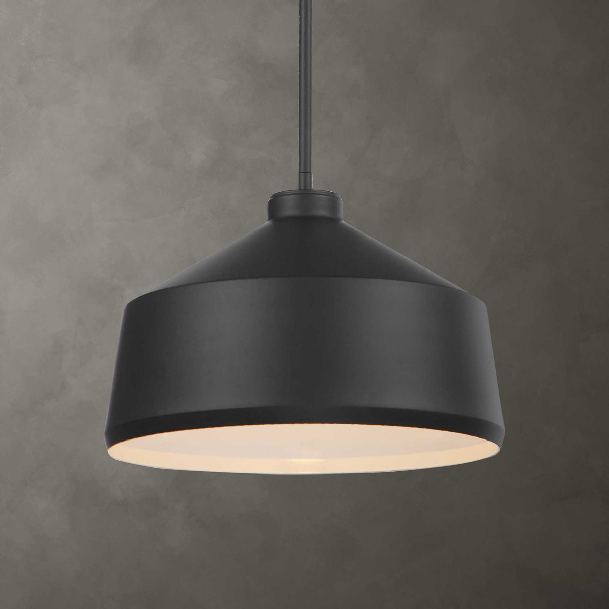 Uttermost Holgate 1-light black pendant light hanging from ceiling, modern pendant lighting fixture with sleek black finish.