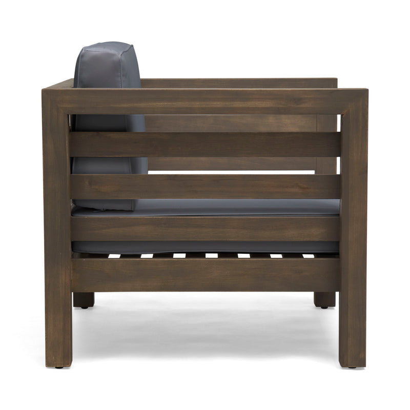 Noble House outdoor acacia wood patio arm chair with fabric cushion, showcasing a sturdy wooden frame and comfortable seating.