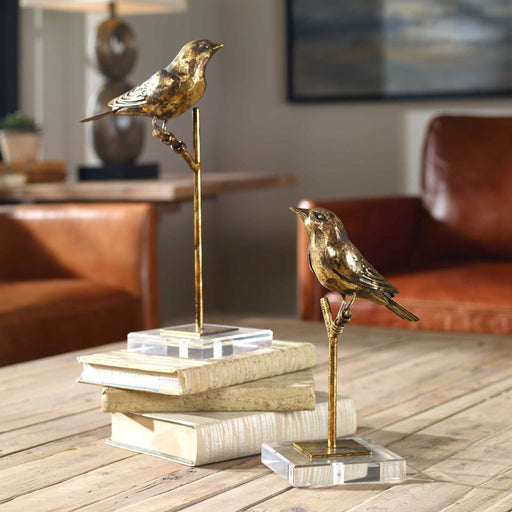 Light brown bird sculptures set of 2 by Uttermost, detailed figurines representing passerine birds for home decor.