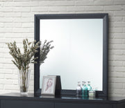 Glory Furniture Primo mirror with sleek rectangular frame, wall-mounted design, reflecting a modern interior style.