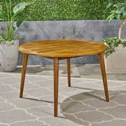 Noble House Stamford outdoor dining table with modern design, featuring a sleek rectangular surface and sturdy metal legs.