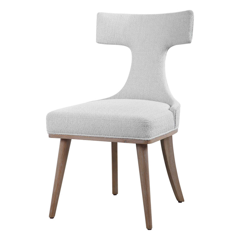 Pair of white Klismos accent chairs by Uttermost, featuring elegant wooden legs and curved backrests for stylish seating.