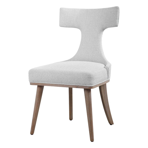 Pair of white Klismos accent chairs by Uttermost, featuring elegant wooden legs and curved backrests for stylish seating.