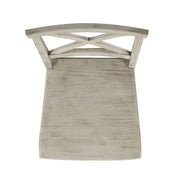 Set of two Noble House Plethora dining chairs with X-shaped back, modern wooden design for stylish dining room seating.