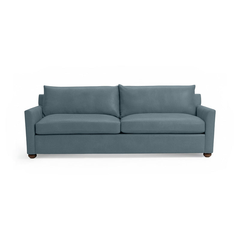 Classic Home Olivia stationary sofa with plush upholstery and elegant design, shown in a modern living room setting.