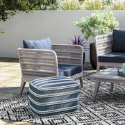 Simpli-Home Santiago outdoor conversation arm chair in slate gray with cushioned seat and armrests for patio or garden use.