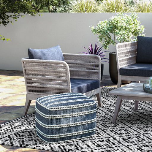 Simpli-Home Santiago outdoor conversation arm chair in slate gray with cushioned seat and armrests for patio or garden use.
