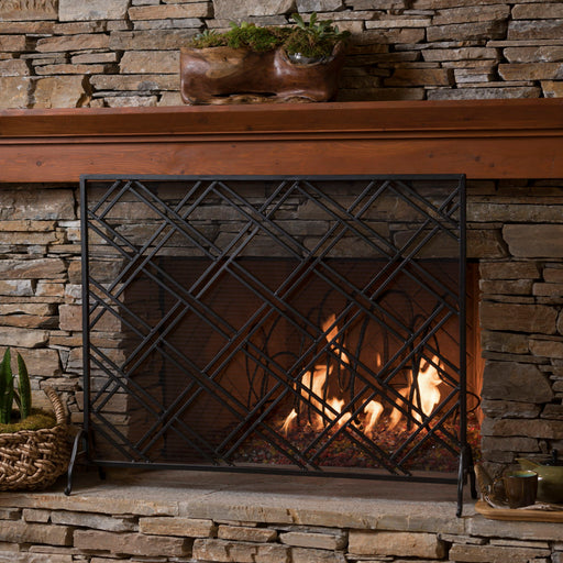 Noble House elegant fireplace screen with intricate metal design serving as a protective barrier for the hearth.