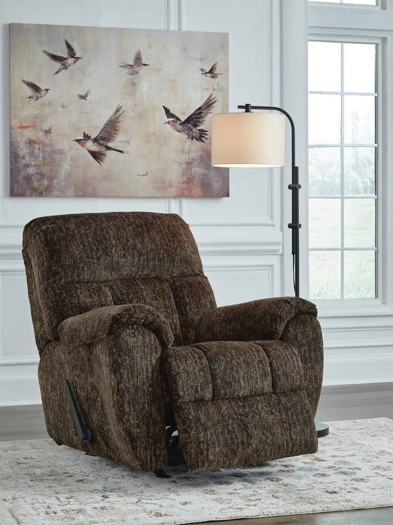 Signature Design by Ashley Stayfish rocker recliner with plush upholstery and wooden base, showcasing a comfortable, modern rocking chair.