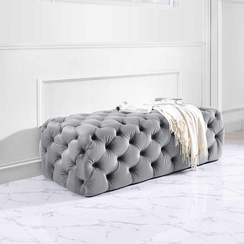 Kaylee velvet upholstered ottoman by TOV Furniture with plush fabric and modern design, shown in a cozy living room setting