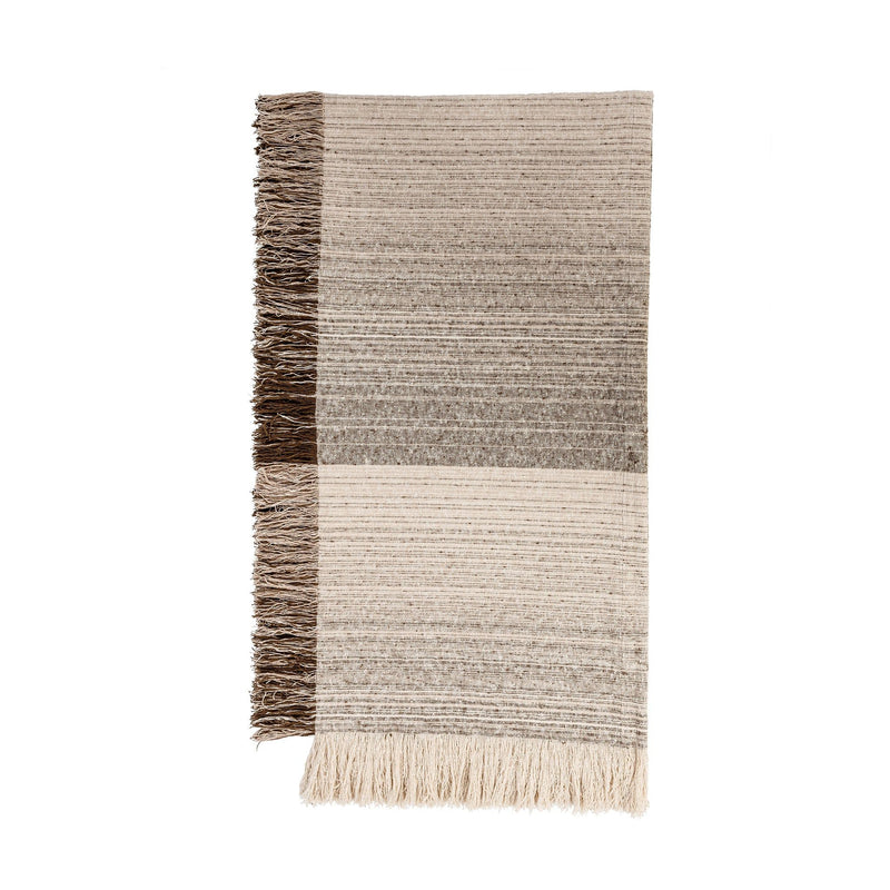 Soft beige Beryl blanket by Classic Home, displayed folded with textured fabric and cozy appearance.