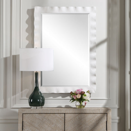 Uttermost Haya scalloped accent mirror with a decorative, scalloped frame, perfect for enhancing interior decor.