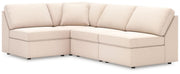 Signature Design by Ashley oyster sectional sofa from the Modmax stationary sectional collection, showing plush cushions and fabric upholstery.