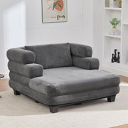 Noble House oversized chaise lounge sofa bed with deep seat and layered armrests, upholstered in neutral fabric.