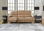 Ashley Mosswell power reclining sofa with adjustable headrest in toffee color, featuring plush cushions and a modern design.