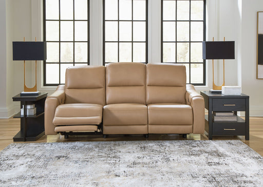 Ashley Mosswell power reclining sofa with adjustable headrest in toffee color, featuring plush cushions and a modern design.