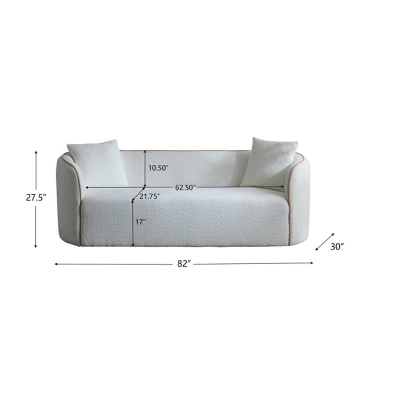 Noble House Coral curved 3-seater stationary sofa with plush cushions and modern design, shown in a stylish living room setting.
