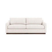 Classic Home Aspen stationary sofa with plush cushions and elegant design, shown in a cozy living room setting.
