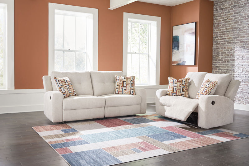 Signature Design by Ashley Danum reclining sofa and loveseat set in a modern living room with plush fabric and comfortable seating.