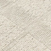 Classic Home Sinclair wool area rug featuring a textured, neutral-toned design perfect for living room or bedroom decor.