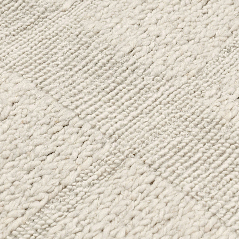Classic Home Sinclair wool area rug featuring a textured, neutral-toned design perfect for living room or bedroom decor.