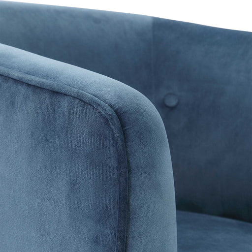 Blue Uttermost Mallorie swivel chair with cushioned seat and back, modern design, and metal base for comfortable seating.