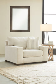 Signature Design by Ashley Maggie living room set with stationary chair and matching ottoman in stylish upholstery.
