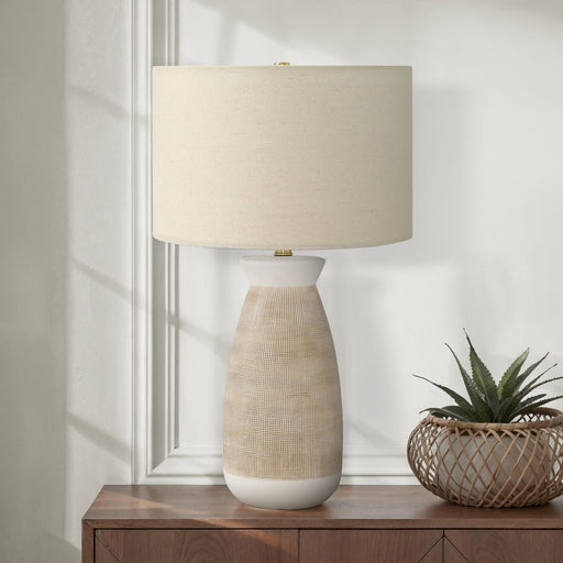 Contemporary cream ceramic and resin table lamp by 8th Street, featuring a sleek, modern design for stylish home lighting.