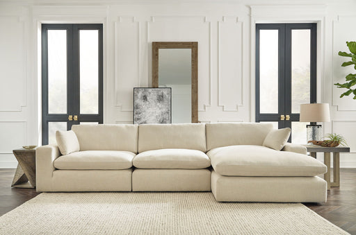 Benchcraft Elyza sectional set with four-piece living room furniture arrangement featuring plush cushions and modern design.