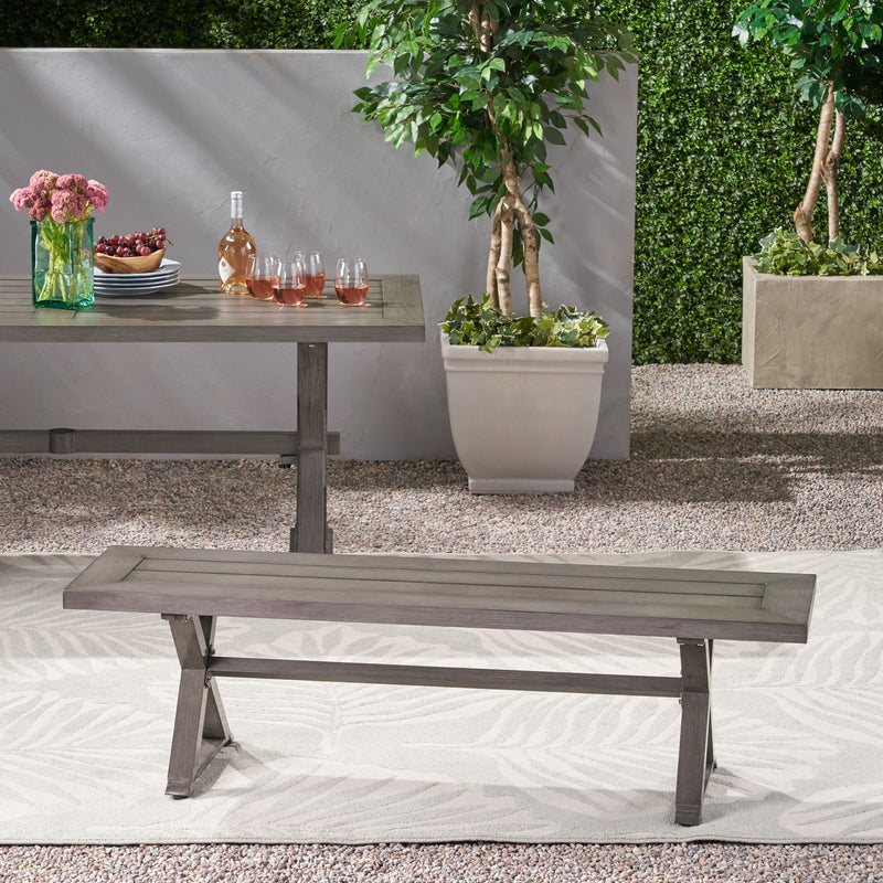 Dark gray modern aluminum outdoor dining bench with X base by Noble House, featuring sleek design and sturdy construction.