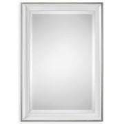 Uttermost Lahvahn white silver wall mirror with a sleek, modern frame hanging on a wall.
