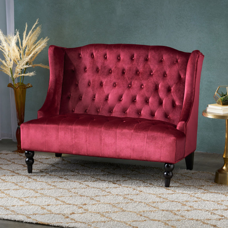 Noble House upholstered loveseat with wingback design, diamond tufting, and plush fabric for a cozy, elegant seating option.