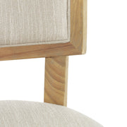 Set of two Noble House farmhouse style fabric upholstered side dining chairs with wooden legs and cushioned seats.