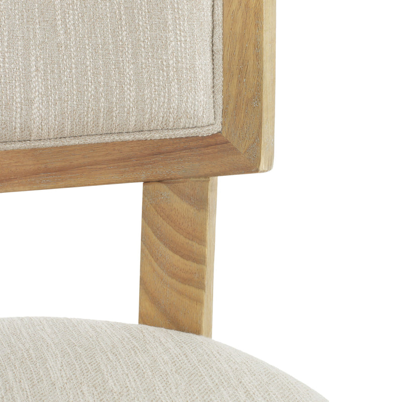 Set of two Noble House farmhouse style fabric upholstered side dining chairs with wooden legs and cushioned seats.