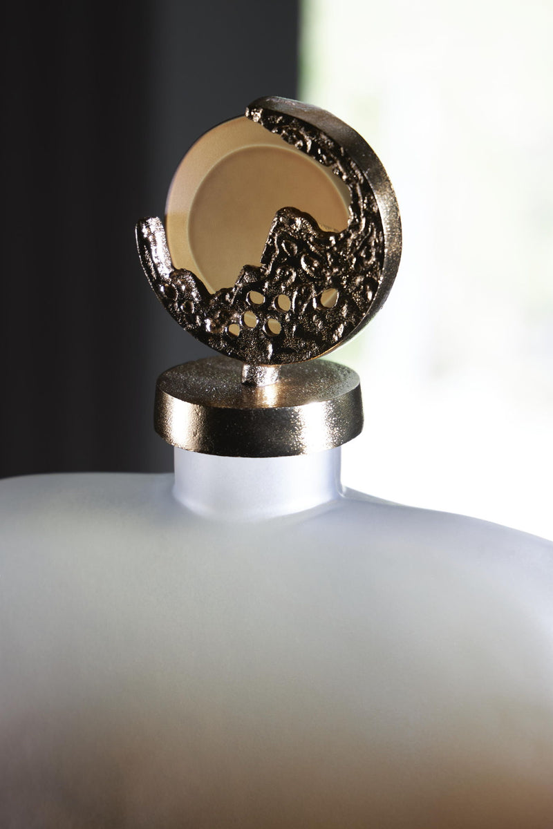 Signature Design by Ashley Acario jar in a neutral finish, showcasing its smooth surface and elegant shape.