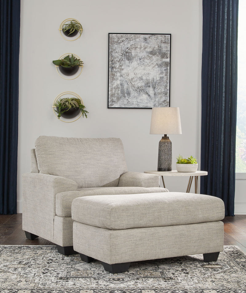 Signature Design by Ashley Vayda living room set with stationary chair and ottoman, featuring plush upholstery and modern style.