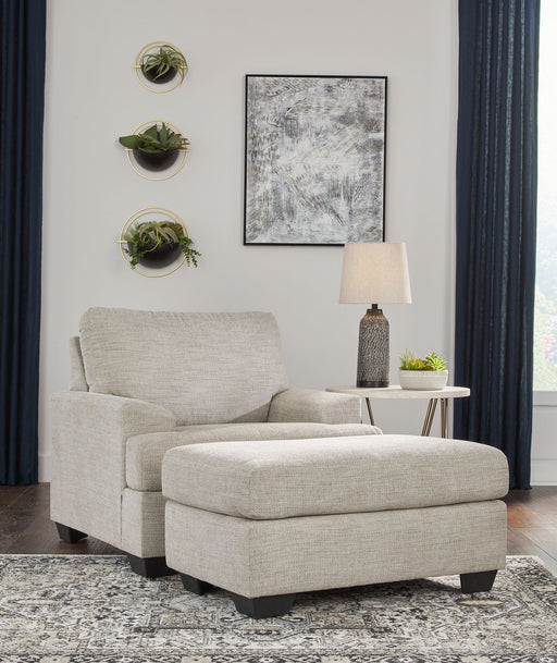 Signature Design by Ashley Vayda living room set with stationary chair and ottoman, featuring plush upholstery and modern style.