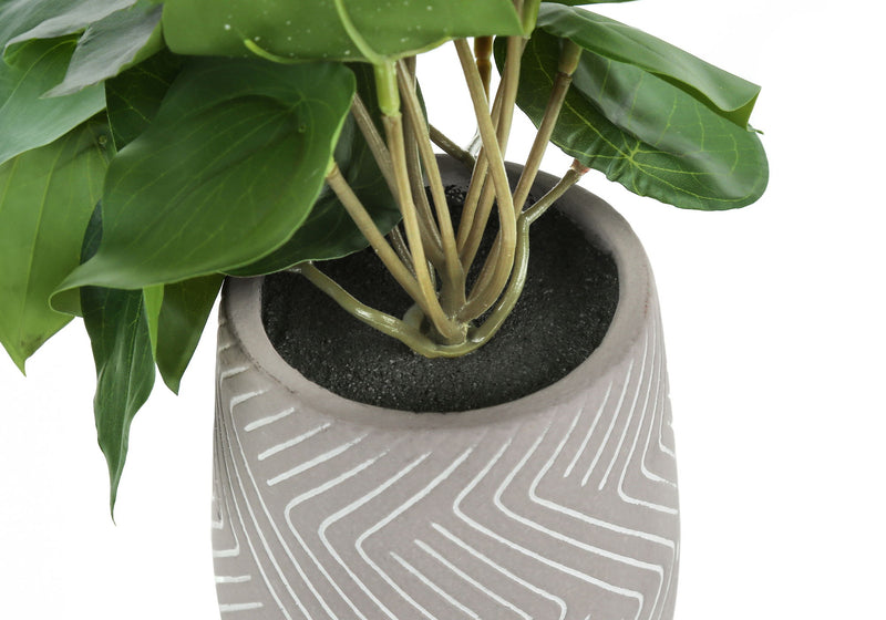 Set of two artificial Alocasia plants from 8th Street, showcasing lush green leaves in decorative pots.