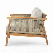 Noble House Sumbawa outdoor club arm chair with woven rattan-style frame and plush cushion, suitable for outdoor patio seating.