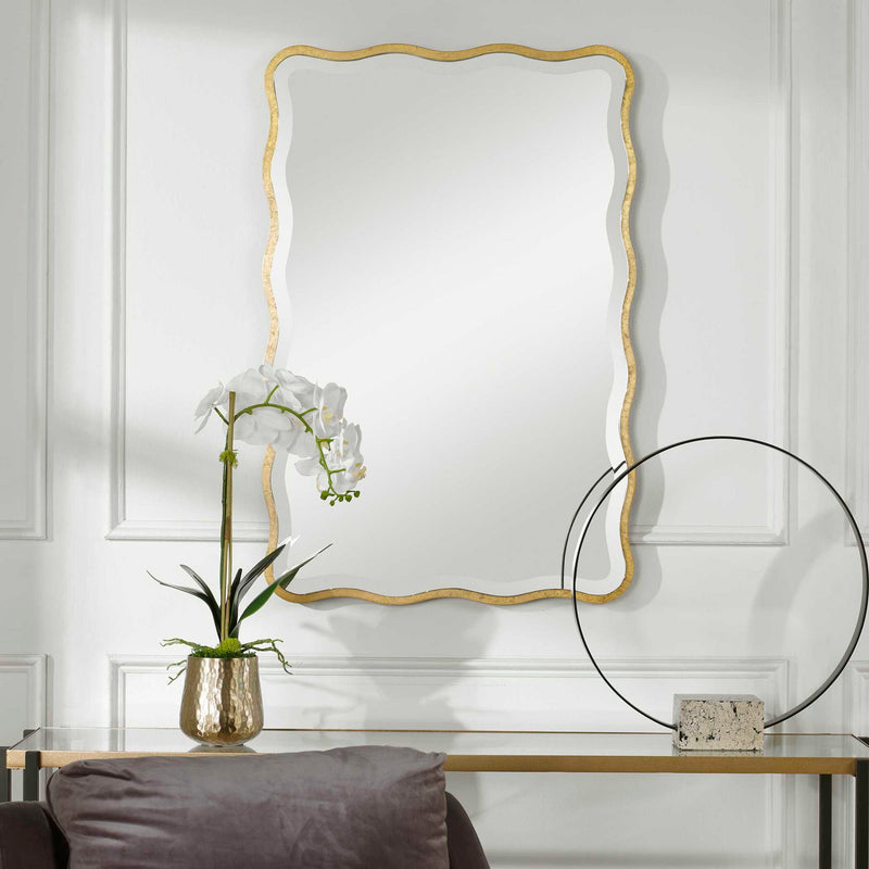 Gold scalloped accent mirror by Uttermost, featuring a decorative frame with elegant curves and intricate design details.