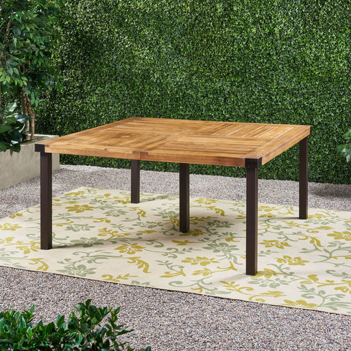 Modern industrial dining table by Noble House with acacia wood slats and teak finish, showcasing a sturdy, stylish design.